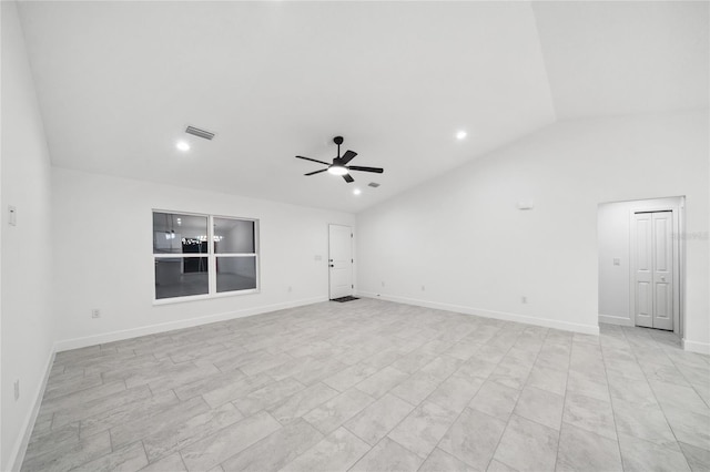 empty room featuring ceiling fan and vaulted ceiling