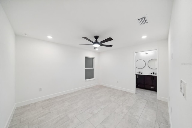 unfurnished room with ceiling fan