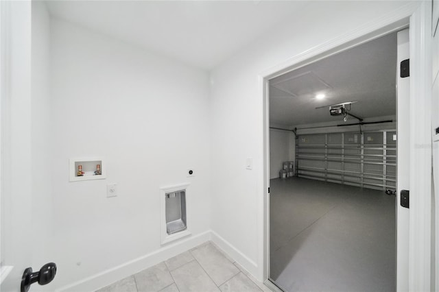 washroom featuring washer hookup, light tile patterned floors, and hookup for an electric dryer