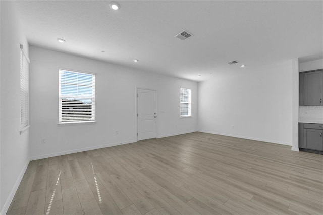 unfurnished living room with light wood-type flooring