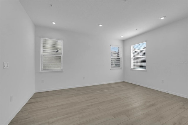 spare room featuring light hardwood / wood-style flooring