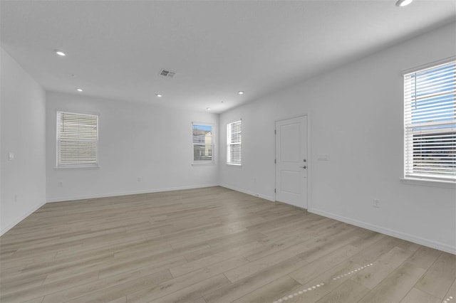 spare room with light wood-type flooring