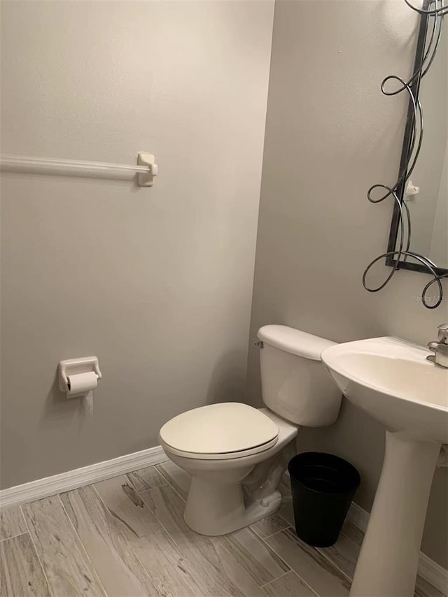 bathroom with toilet and sink