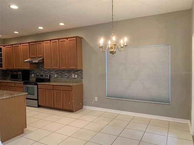 kitchen featuring light tile patterned floors, stainless steel appliances, a chandelier, and hanging light fixtures