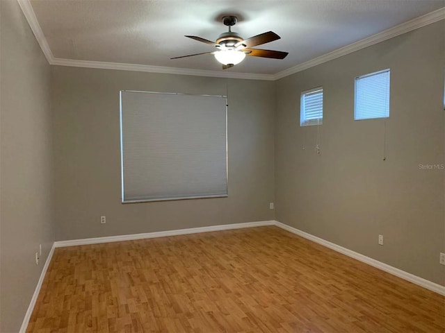 unfurnished room featuring ceiling fan, crown molding, and light hardwood / wood-style flooring