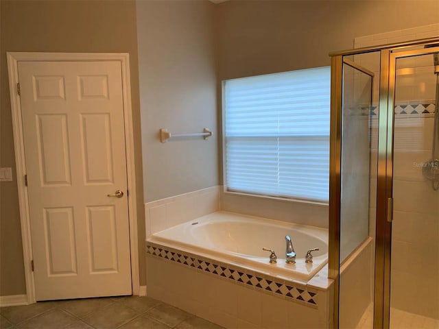 bathroom featuring independent shower and bath and tile patterned floors