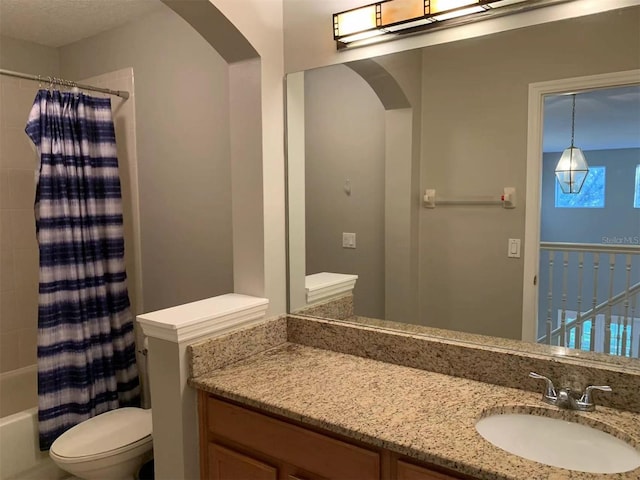 full bathroom with toilet, vanity, and shower / bath combination with curtain