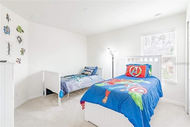 bedroom with light colored carpet