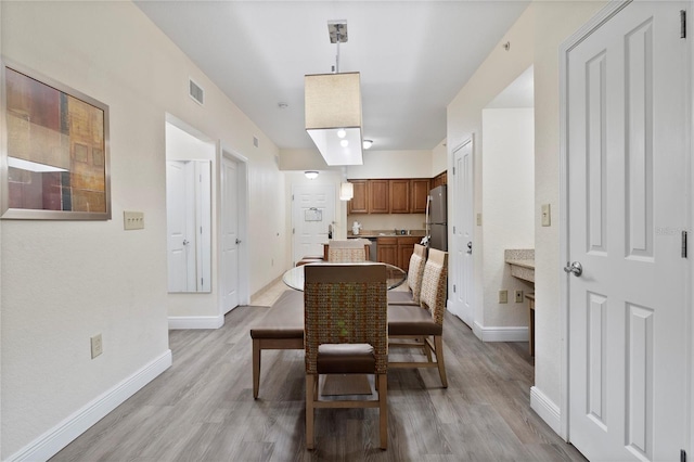 dining area featuring light hardwood / wood-style floors