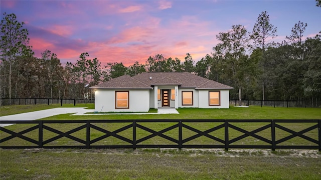 view of front of house with a yard