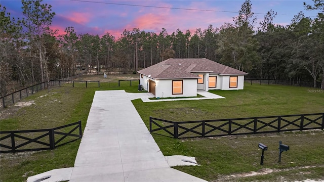 view of front of property with a yard