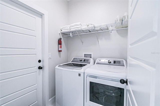 laundry room featuring independent washer and dryer