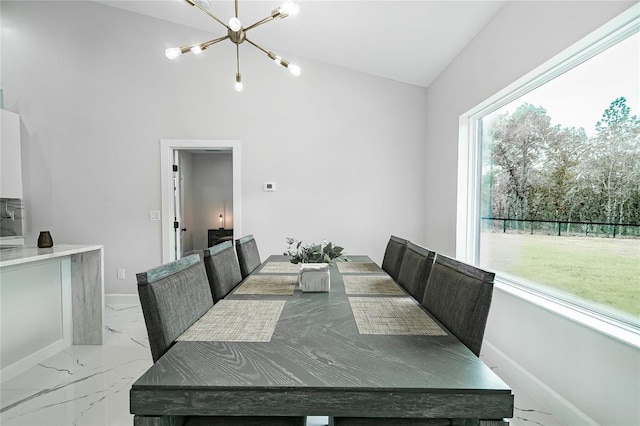 dining room with vaulted ceiling and a chandelier