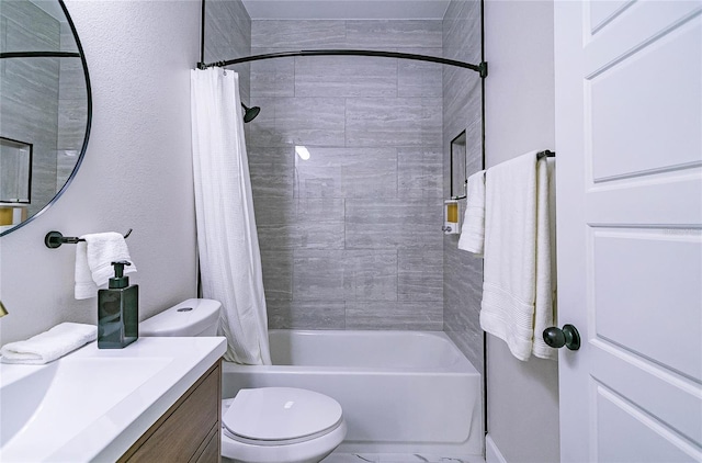 full bathroom featuring toilet, vanity, and shower / bath combination with curtain