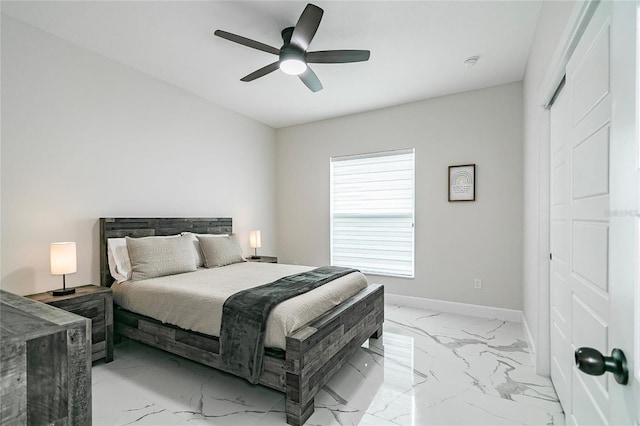 bedroom with ceiling fan and a closet