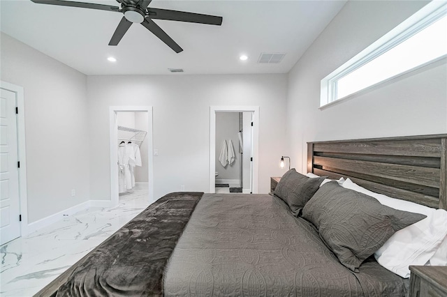 bedroom featuring ensuite bath and ceiling fan