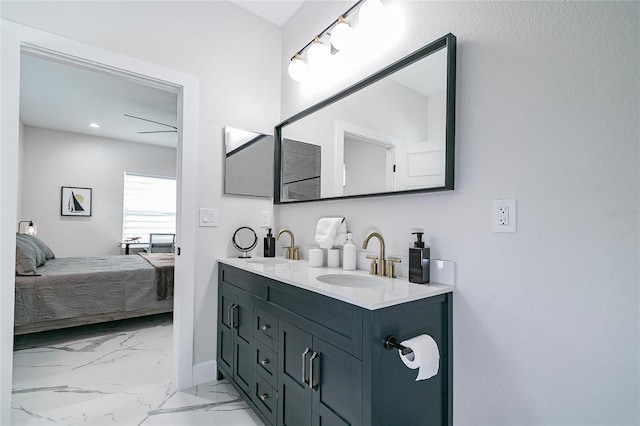 bathroom with ceiling fan and vanity