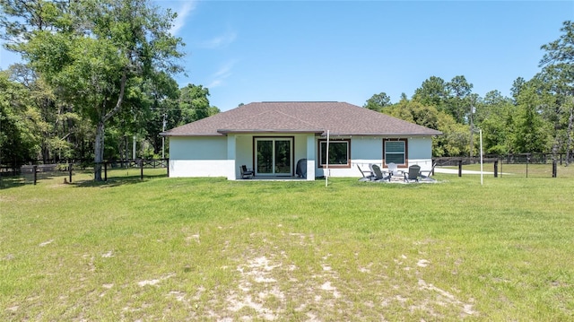 back of house featuring a yard