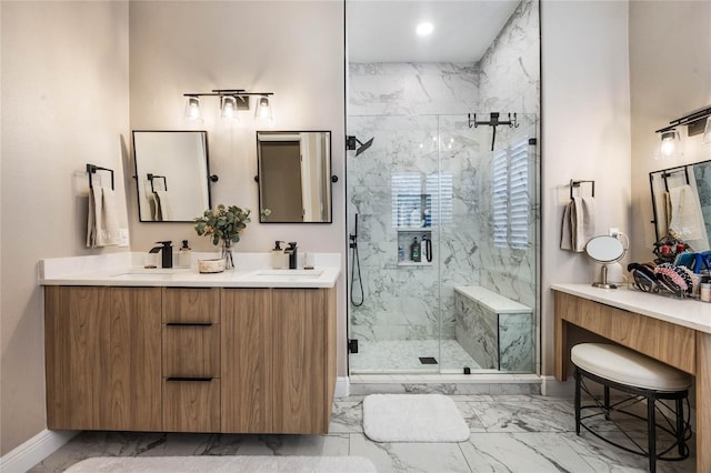 bathroom with a shower with shower door and vanity