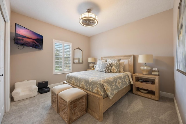 bedroom with light colored carpet