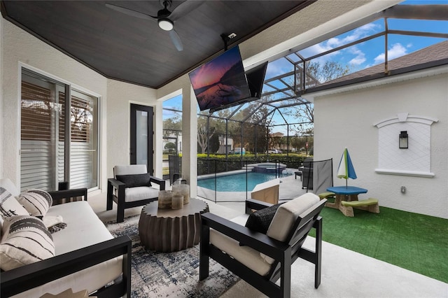 view of patio / terrace with a lanai, an outdoor hangout area, and ceiling fan