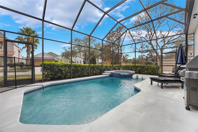 view of swimming pool featuring a lanai, a patio, and an in ground hot tub