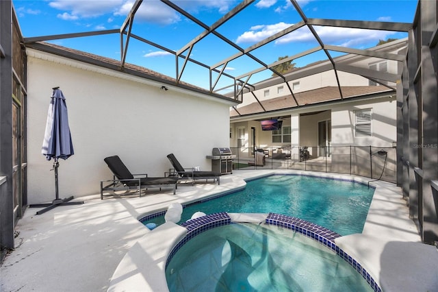 view of pool with an in ground hot tub, a lanai, a grill, and a patio area