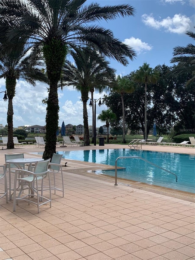 view of pool featuring a patio