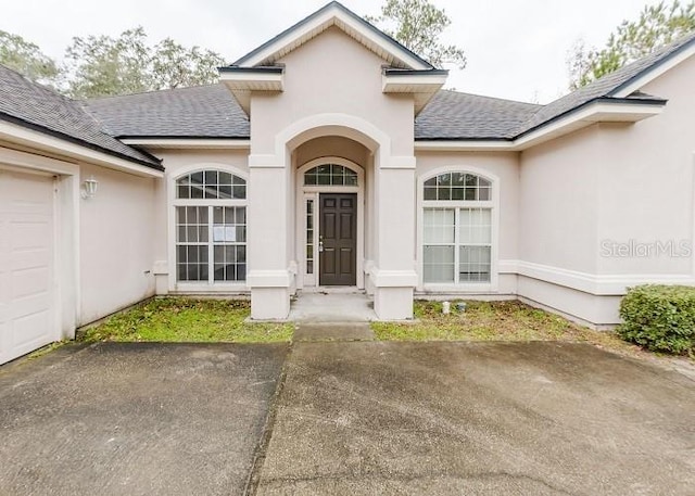 property entrance with a garage