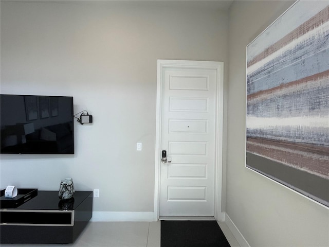 doorway with tile patterned flooring