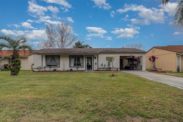 view of front of property with a carport and a front yard