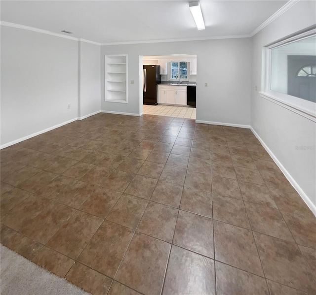 unfurnished living room with ornamental molding, sink, tile patterned floors, and built in shelves