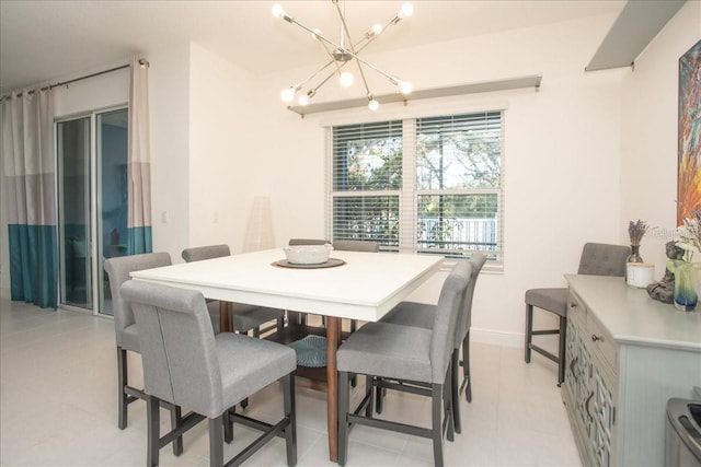 dining area featuring a chandelier and light tile patterned floors