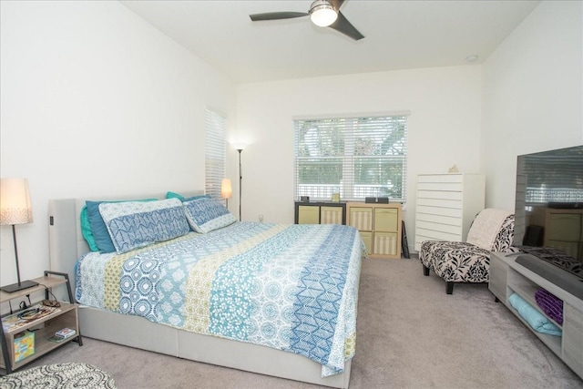 bedroom with light colored carpet and ceiling fan