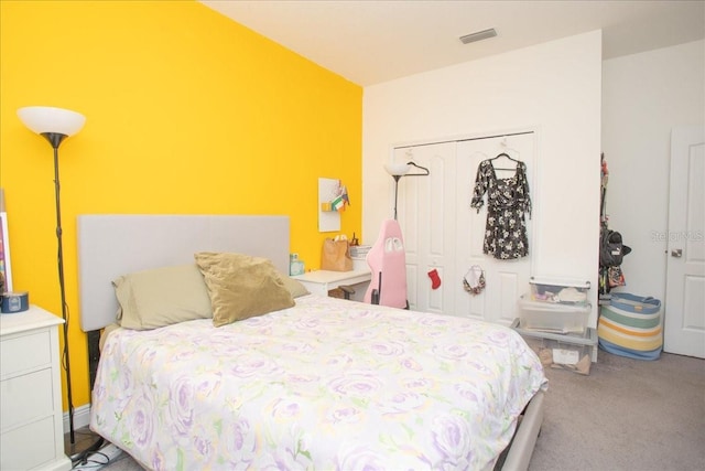 carpeted bedroom featuring a closet