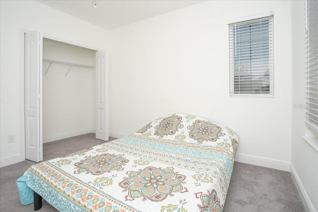 carpeted bedroom featuring a closet