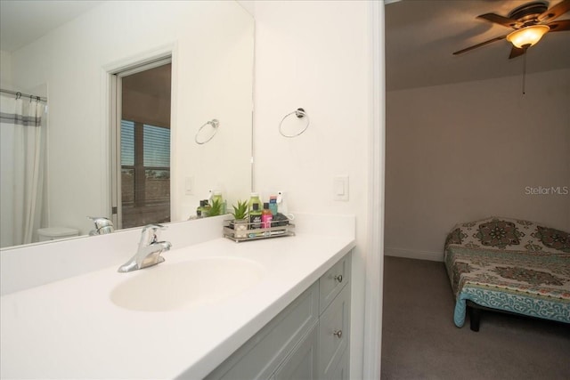 bathroom featuring vanity, ceiling fan, and toilet