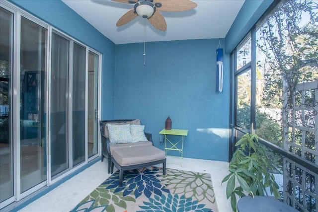 sunroom / solarium with ceiling fan