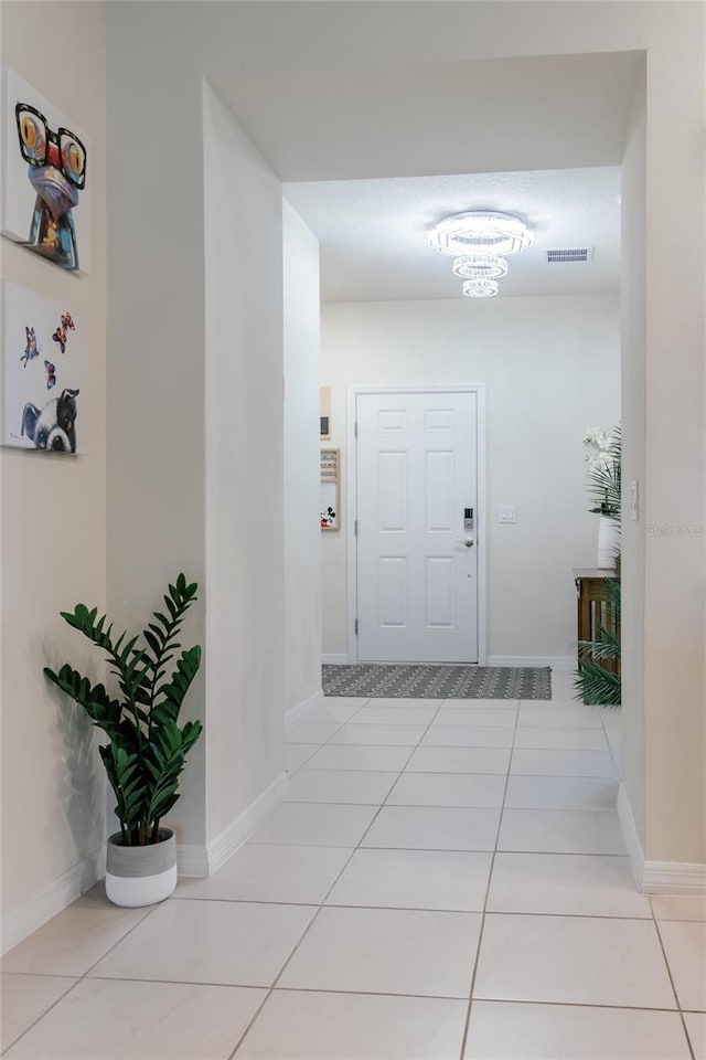 hallway featuring light tile patterned floors