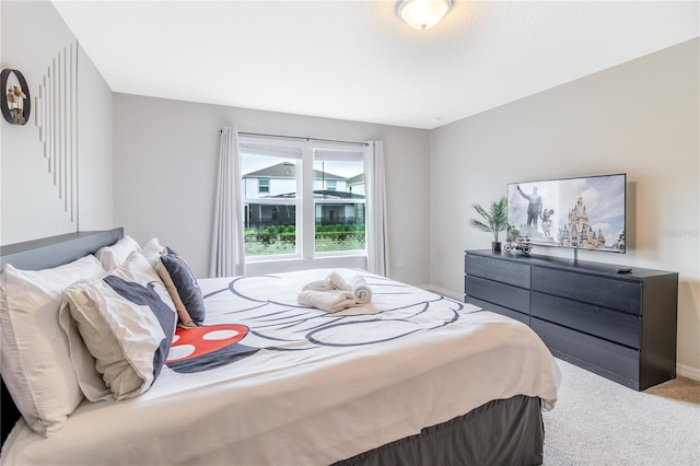 bedroom featuring light colored carpet