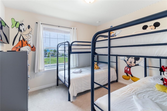 carpeted bedroom with multiple windows