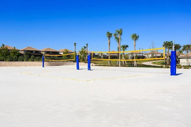 view of home's community featuring volleyball court