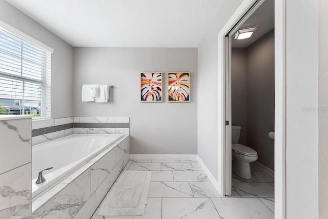 bathroom with toilet and a relaxing tiled tub