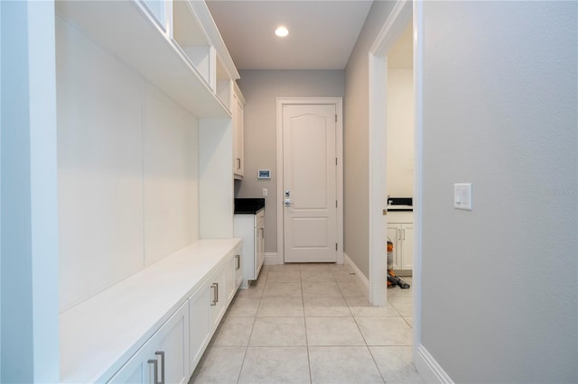 mudroom with light tile patterned flooring