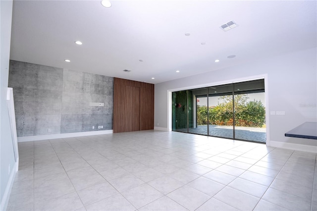 spare room featuring light tile patterned floors