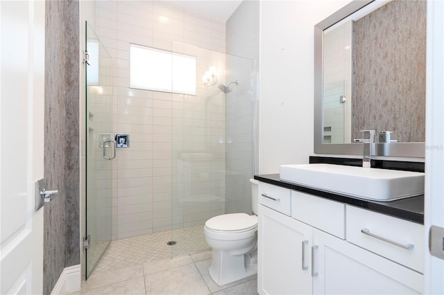 bathroom featuring an enclosed shower, vanity, toilet, and tile patterned flooring