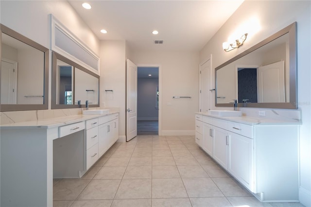 bathroom featuring tile patterned flooring and vanity