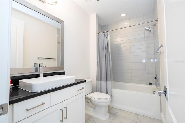 full bathroom featuring shower / bath combo with shower curtain, toilet, tile patterned floors, and vanity