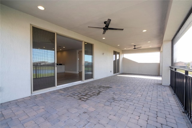 view of patio featuring ceiling fan