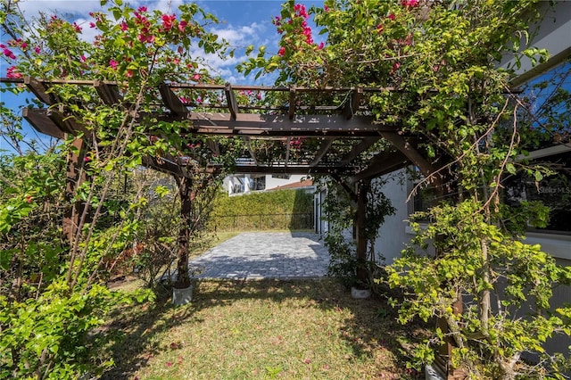 view of yard with a pergola and a patio area